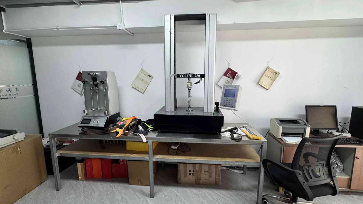 Tensile strength testing equipment measuring zipper pull force at CEO Zipper QC lab
