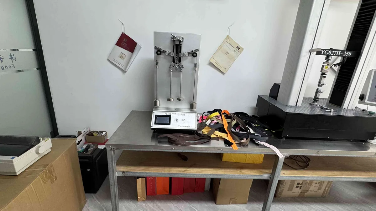 Tensile strength testing equipment measuring zipper pull force at CEO Zipper QC lab